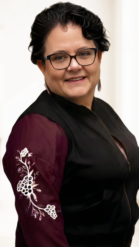 Michelle McLarty, founder of Li Troo Doo, wearing a vest with Métis floral beadwork